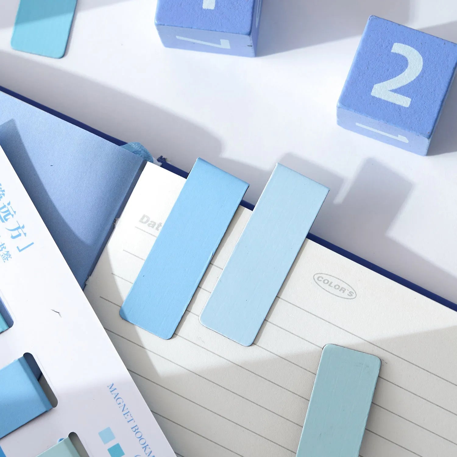 Set of four magnetic Morandi colour block bookmarks showing different colour options