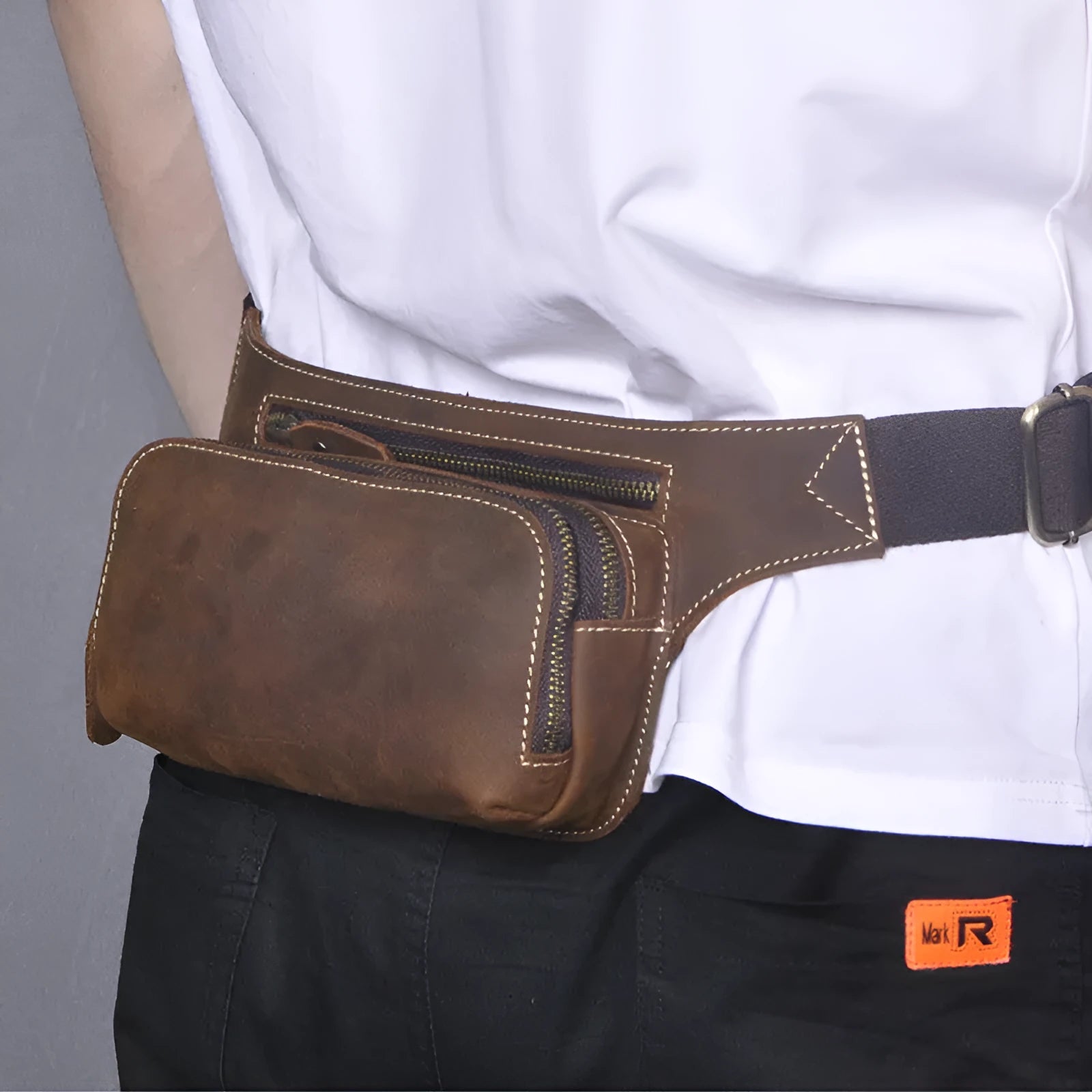 Brown top layer cowhide leather men's sports waist bag showing pull closure