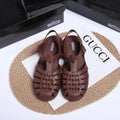 Vintage weave Roman sandals in matte black with buckle closure and round toe
