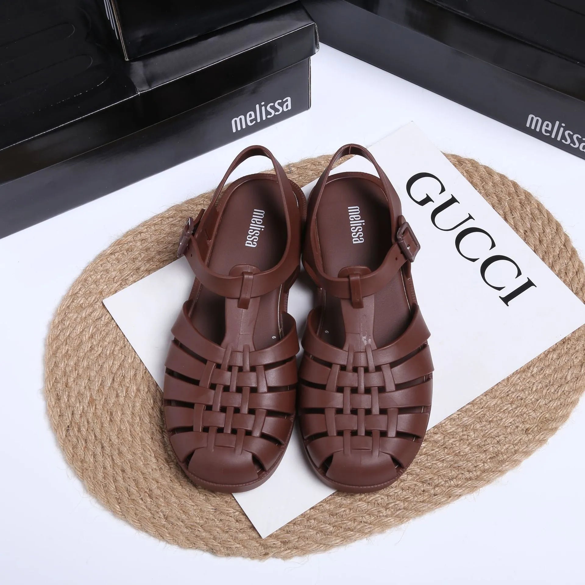 Vintage weave Roman sandals in matte black with buckle closure and round toe