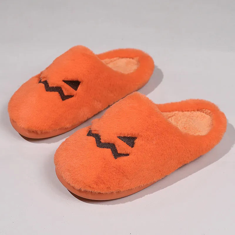 Orange Halloween pumpkin slippers with coral velvet upper and plush lining on non-slip PVC soles