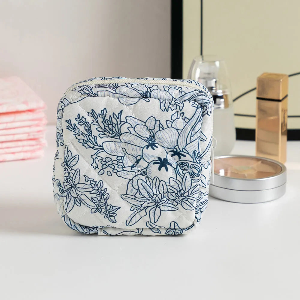 Breathable polyester key storage bag showing multiple floral and cherry pattern options including white background designs