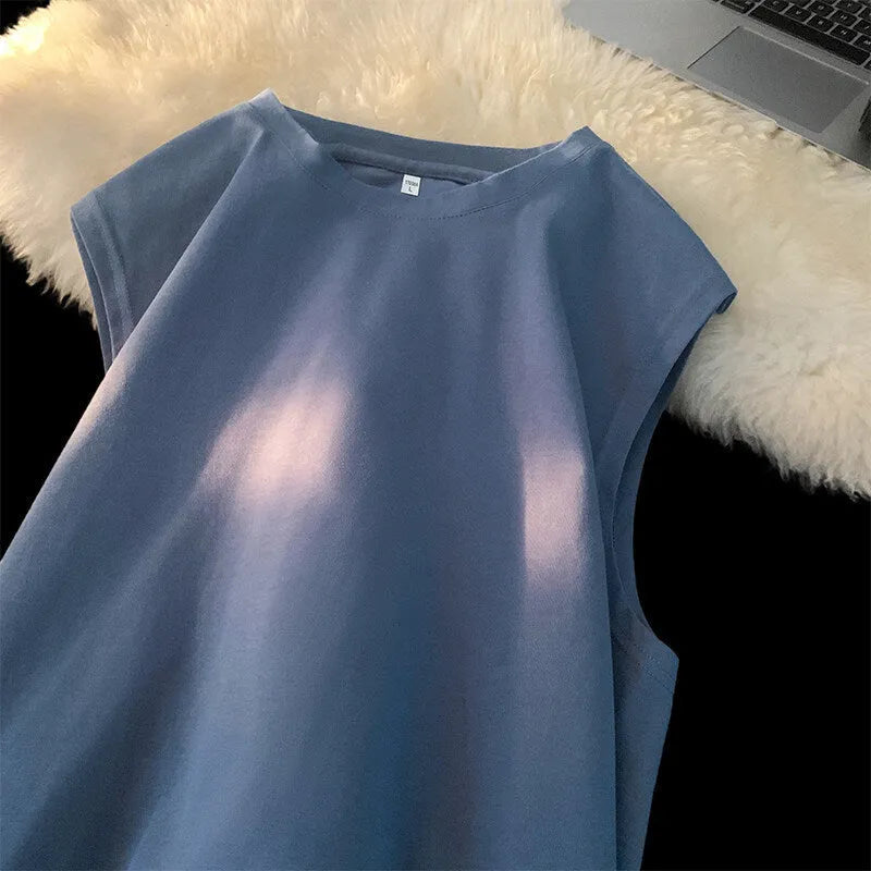 Men's loose solid colour cotton tank top on hanger showing straight hem design