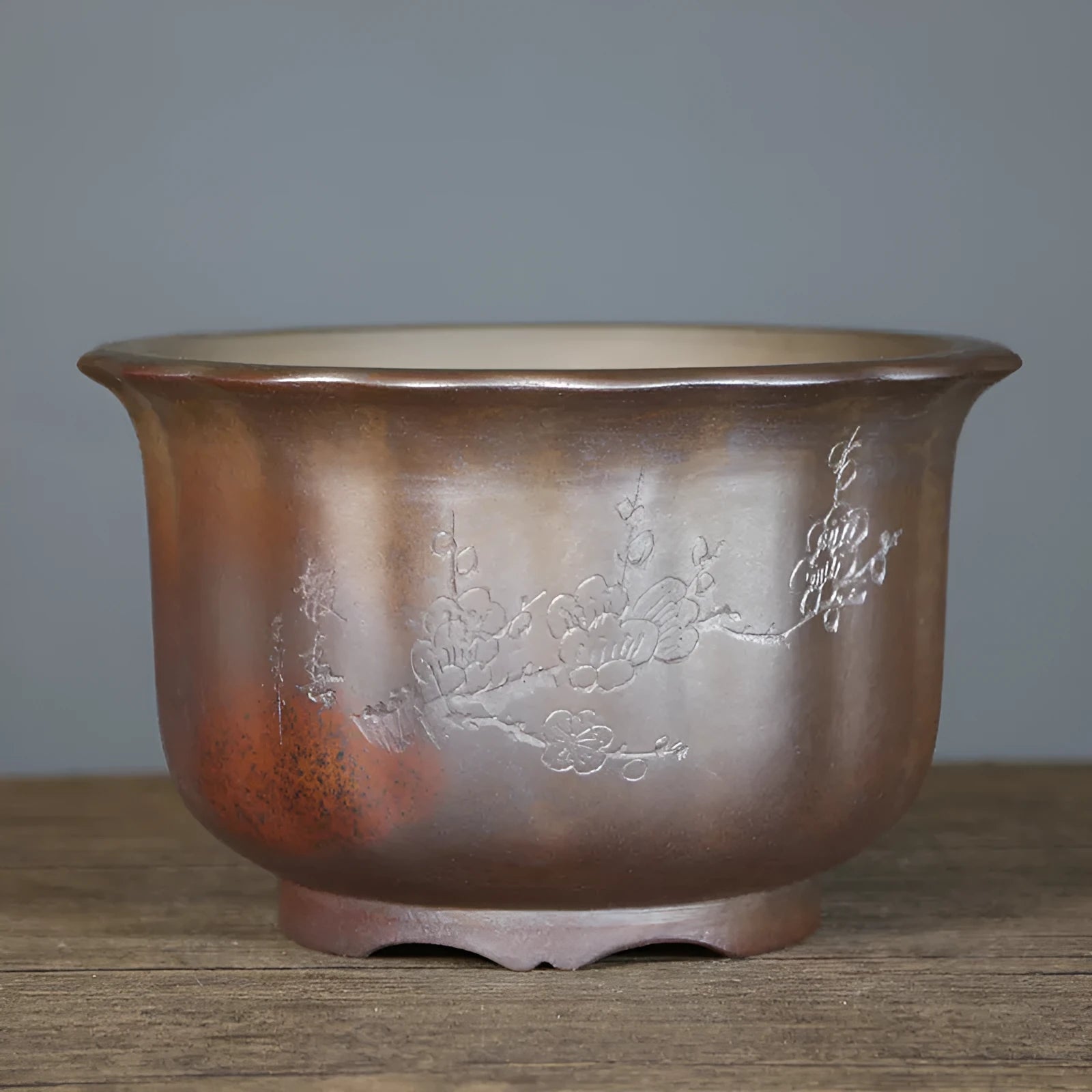 Large indoor ceramic flowerpot with antique carved flower design in purple sand clay
