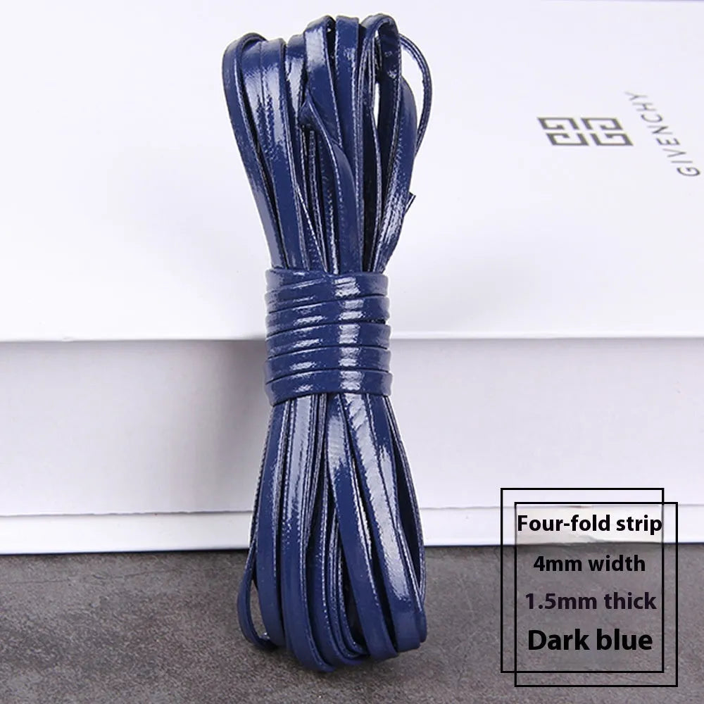 Coils of PU leather craft cord in multiple colours including black, red, blue, and beige