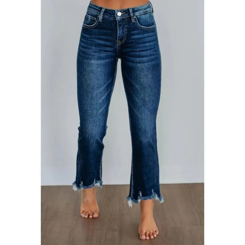 Solid colour women's denim jeans in dark blue and light blue washes, showing hand-worn detail.