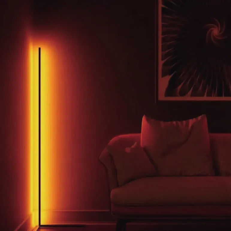 Black smart RGB floor lamp with remote control showing coloured lighting effects
