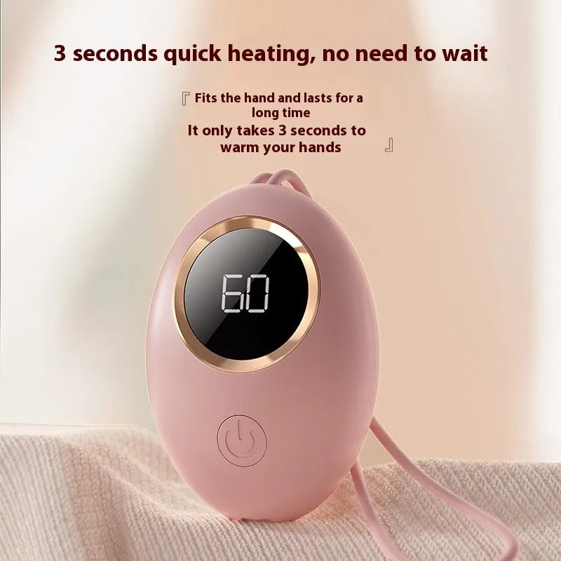 USB digital display hand warmer in pink, showing aluminium heating pad and screen