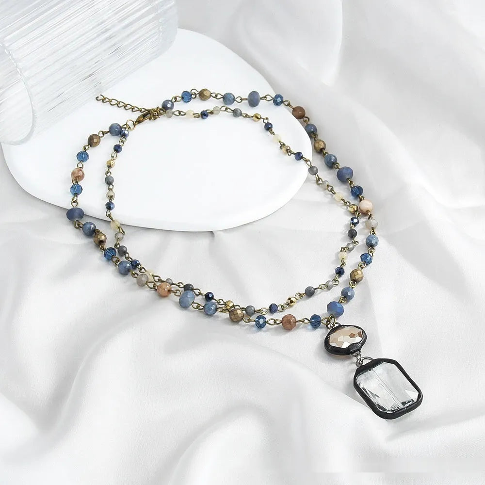 Two-layer tribal necklace with stone and glass pendants on adjustable chain