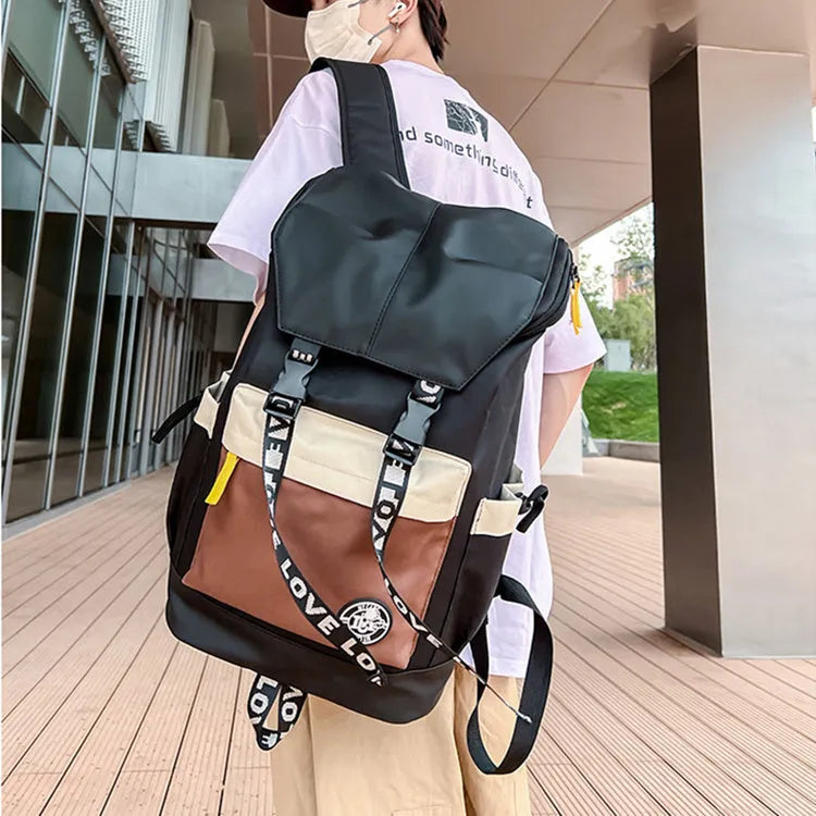 Oxford cloth backpack in black, green, or red with multiple carry handles