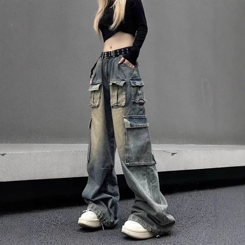 Light blue loose-fit multi-pocket distressed jeans on a hanger