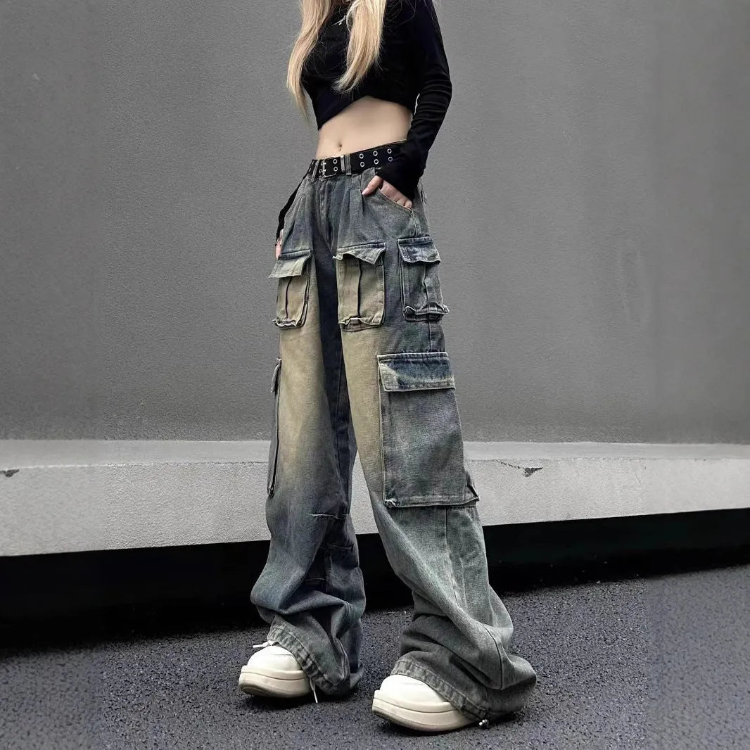 Light blue loose-fit multi-pocket distressed jeans on a hanger