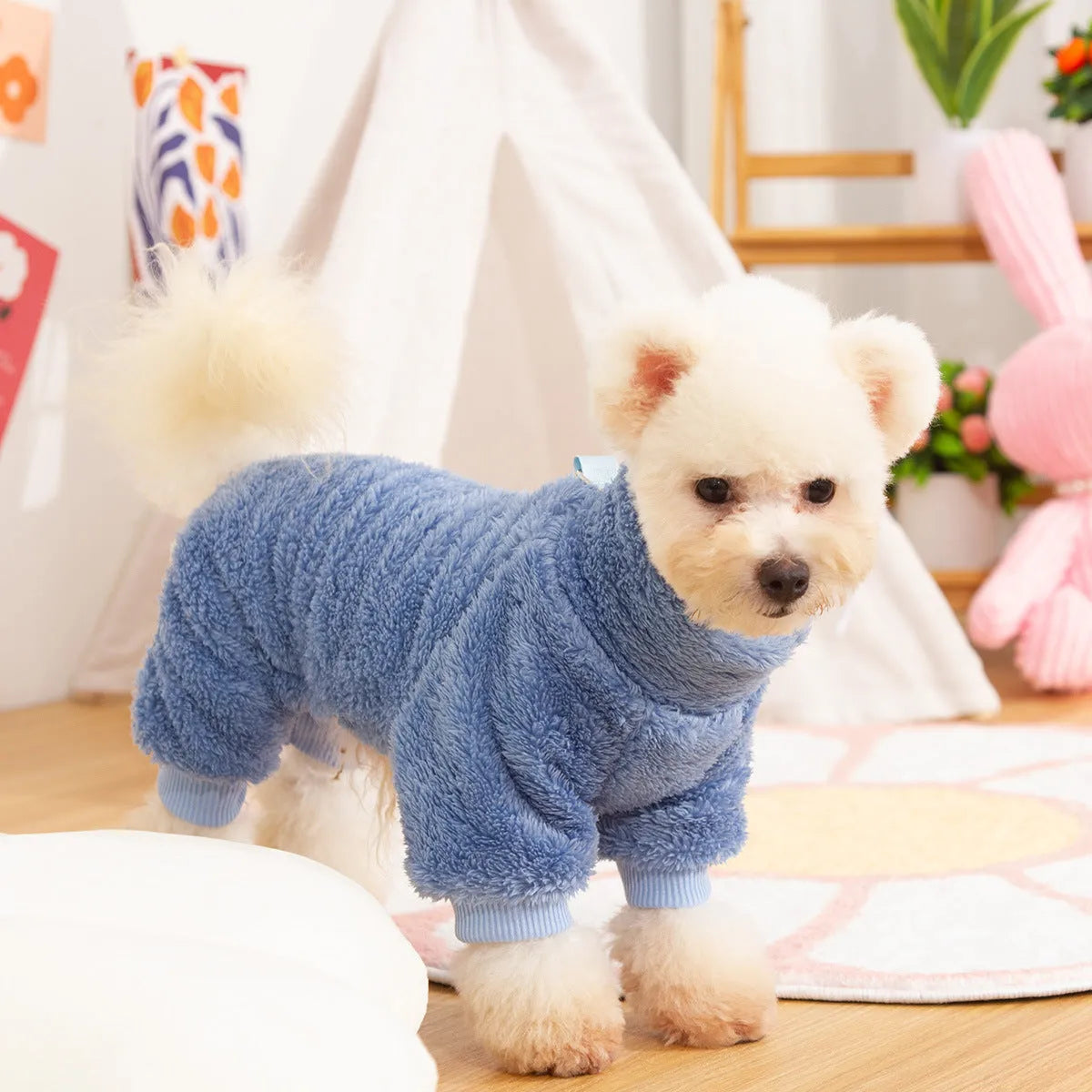 Blue double-sided plush dog clothing with high collar and towing ring on model dog