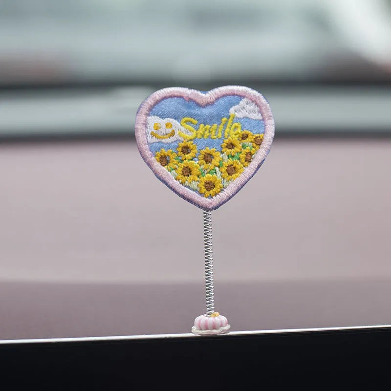 Set of six small cartoon duckling figures and one hello sign for car dashboard decoration.