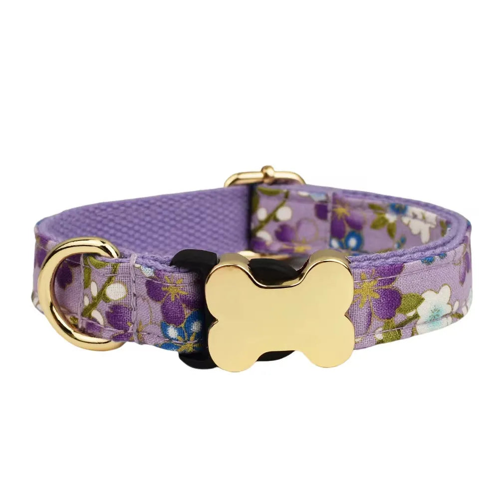 Flat nylon dog collar with grey grid print and a white bone-shaped plastic buckle.