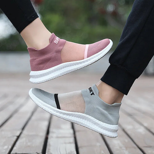 Breathable Flyknit sock shoes in khaki colour with lace-up front and low flat heel design.