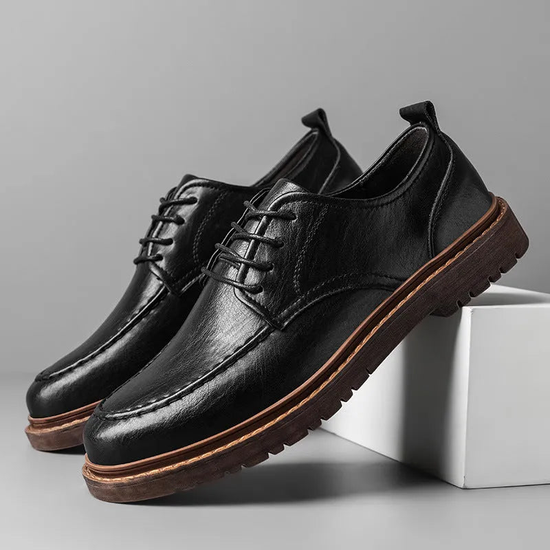 Men's black and brown casual leather shoes with round toe, low top, and flat rubber sole