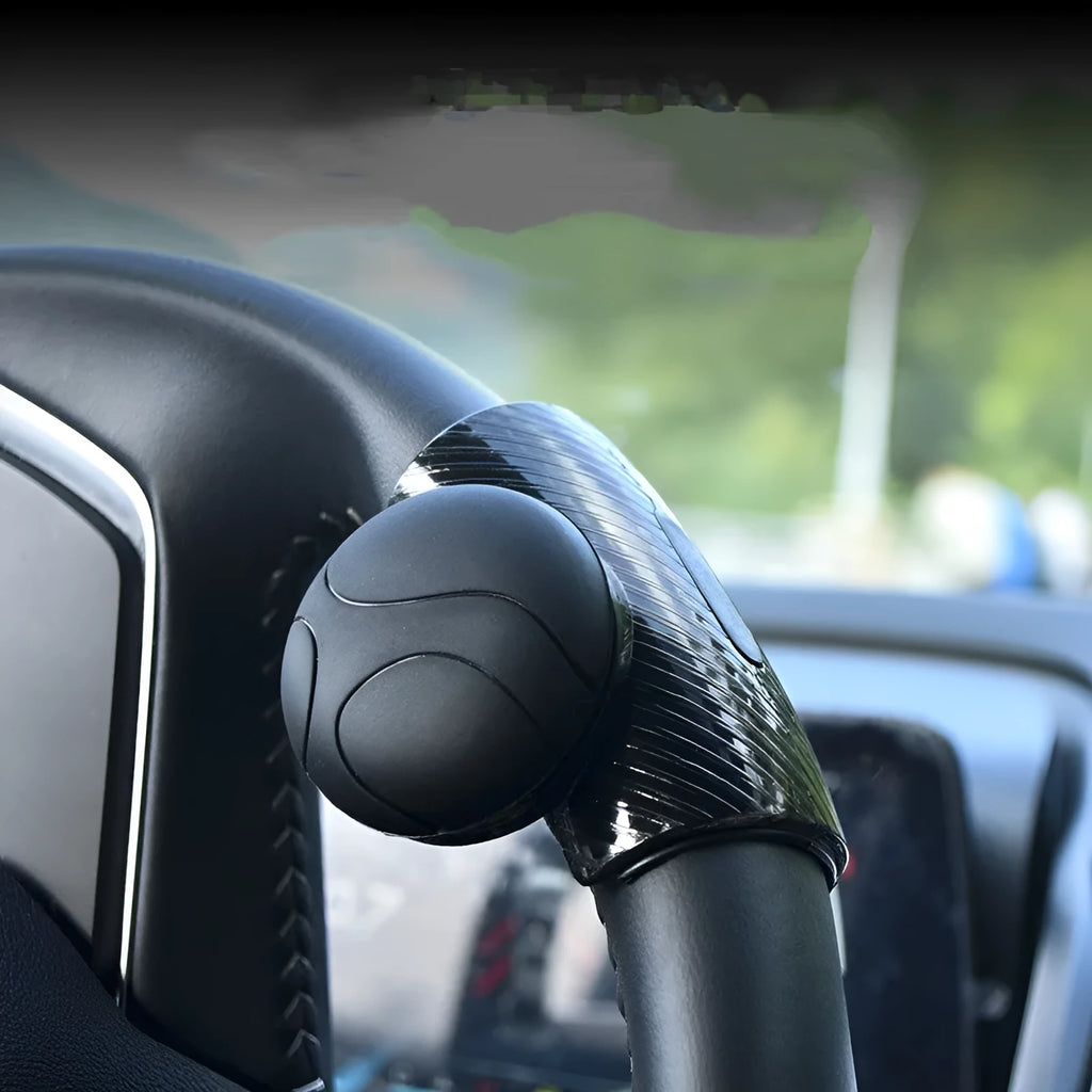 Steering wheel assist ball with silicone exterior and metal bearing for single-hand driving control