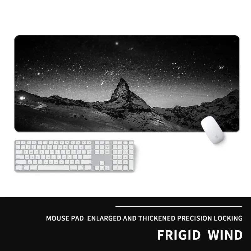 Oversized natural rubber gaming desk mat with graphical print, showing keyboard and mouse placement.