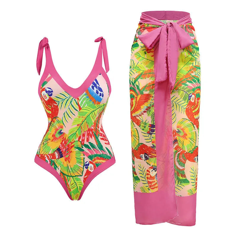 Women's pink floral print one-piece swimsuit with V-neck, covered belly, and attached skirt for swimming