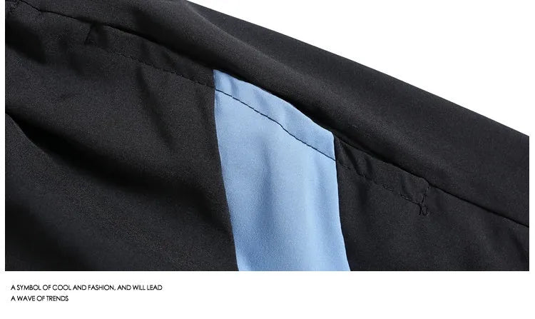 Quick-drying black and grey sports shorts with elastic waistband and straight-leg fit