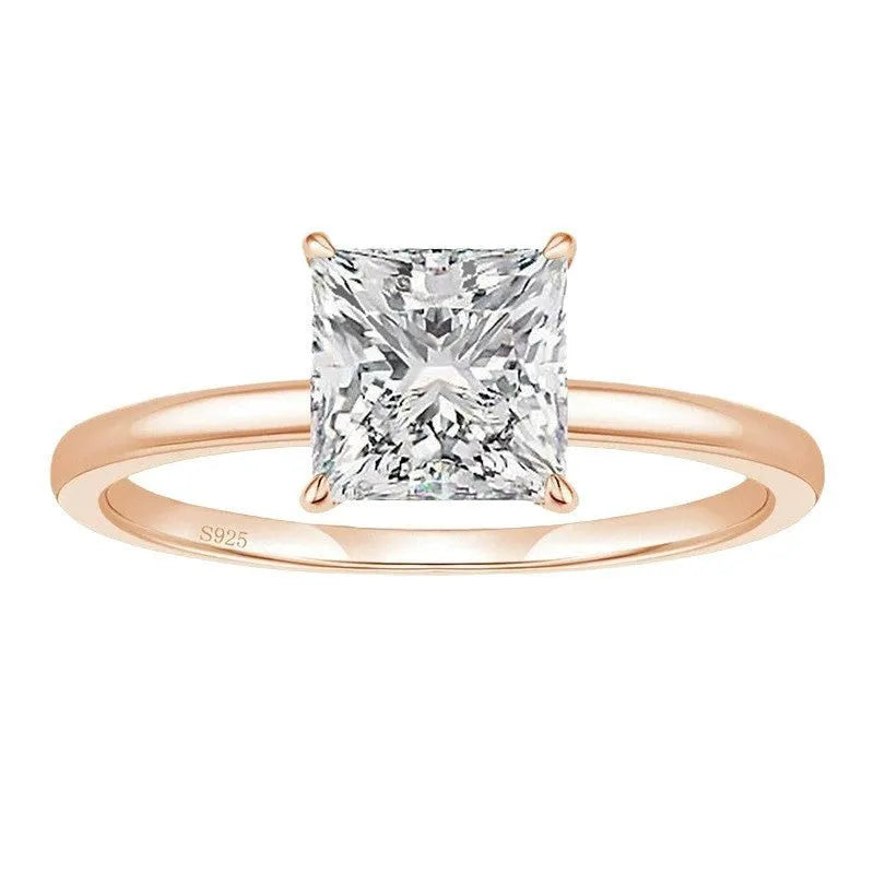 Simple geometric round sterling silver ring shown in silver, gold, and rose gold colour variations on a grey background.