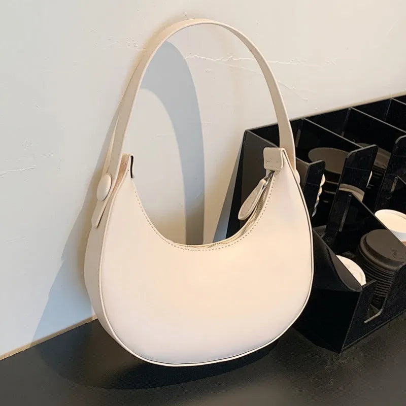 Women's retro shoulder bag in dumpling shape with sandwich pocket and zippered compartment