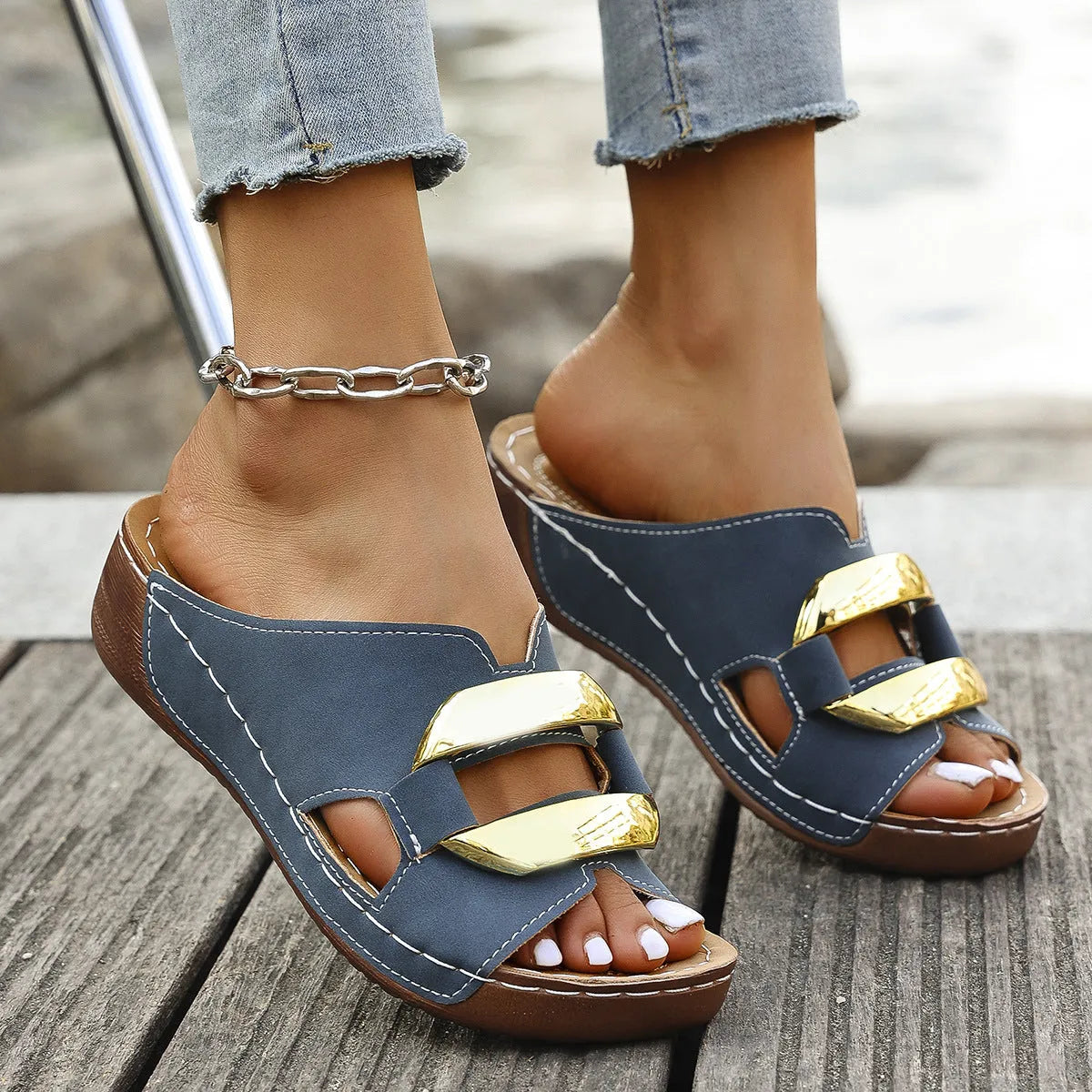 Roman style platform flip-flop sandals in white, black, khaki, and sea blue on a solid background