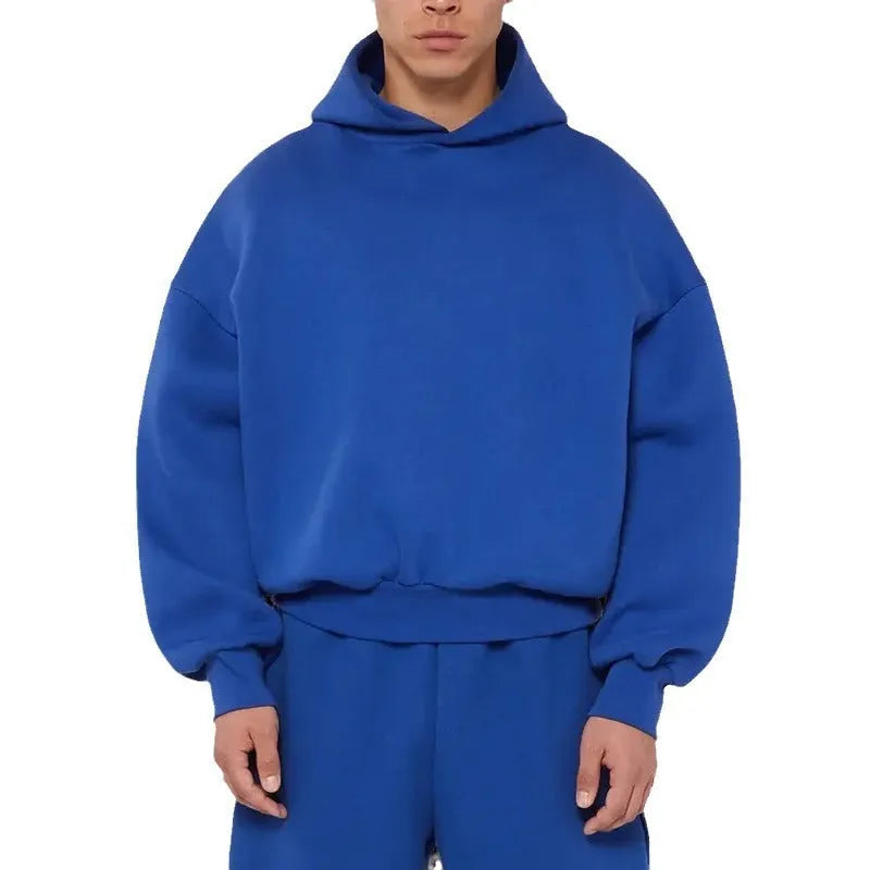 Men's grey fleece-lined cotton pullover hoodie with long sleeves on a hanger.
