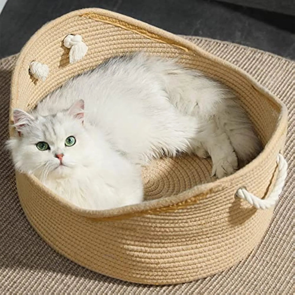 Wicker cat basket bed with a built-in corrugated cardboard scratching panel.