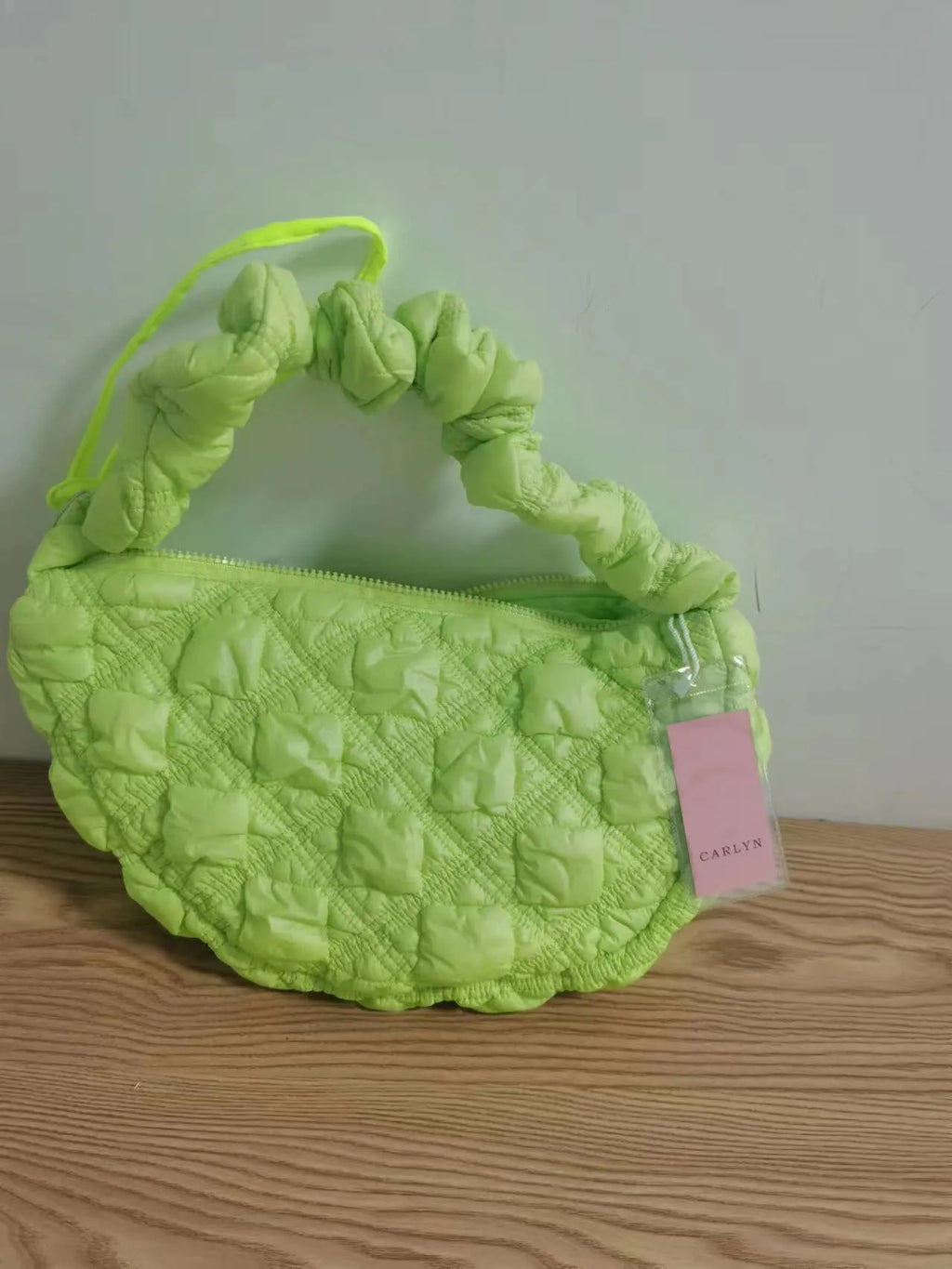 Women's nylon shoulder messenger bag in beige colour showing dimensions and adjustable strap