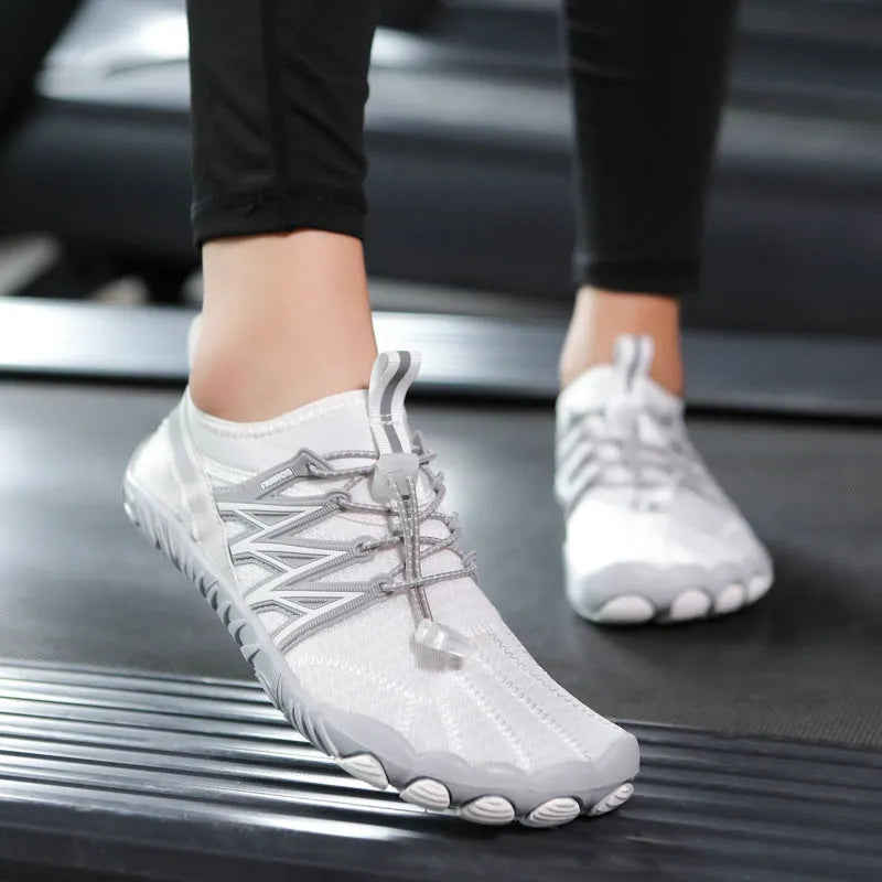 Lightweight indoor fitness training sneakers with low-top design and striped pattern.