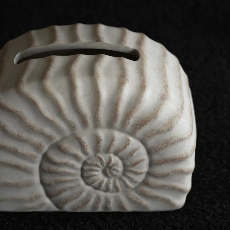 White resin tissue box with conch shell design, modern style, 24cm wide.