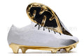 Men's low-top knitted football shoes with white/blue colourway, showing FG studs on rubber outsole and lace-up front.