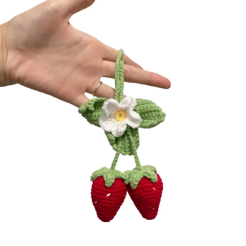 Handmade strawberry-shaped car pendant woven from cotton and hemp with natural colours