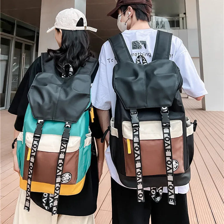 Oxford cloth backpack in black, green, or red with multiple carry handles