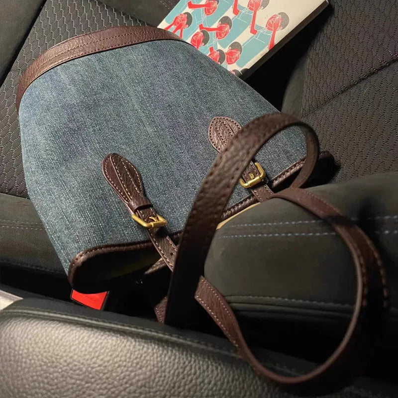 Denim patchwork one-shoulder bucket handbag with polyester construction measuring 23cm by 27cm by 16cm