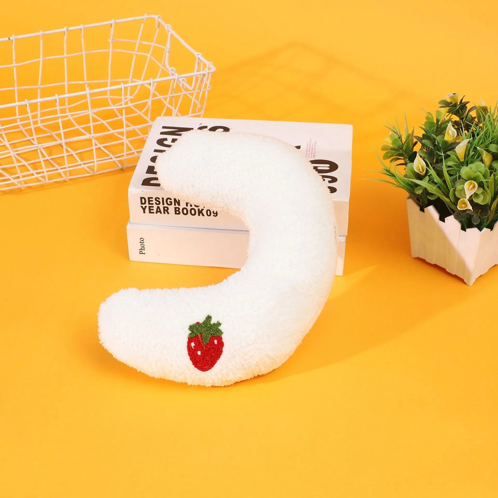 U-shaped half moon cloth pillow pet bed for cats in blue, pink, white, and yellow colours.