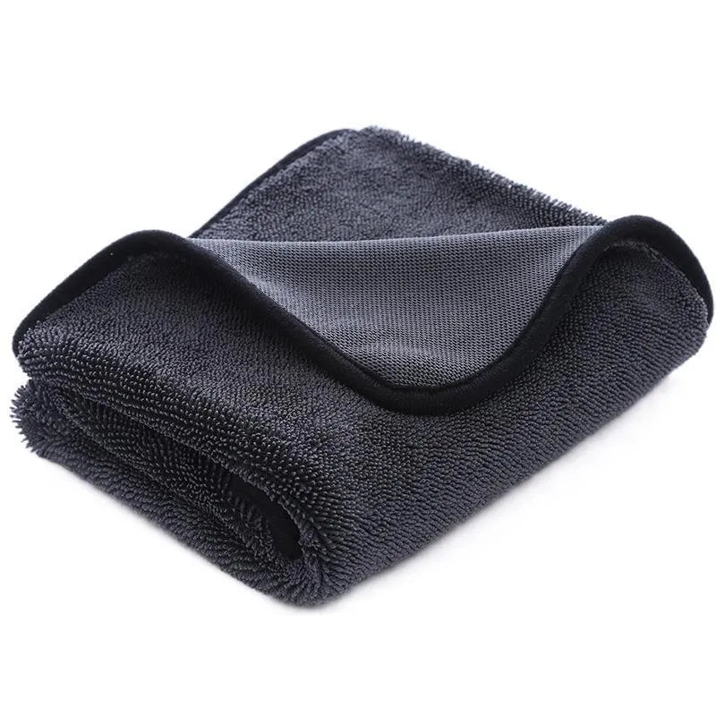 Grey car cleaning towel with red edge trim showing braided texture, laid flat to show dimensions