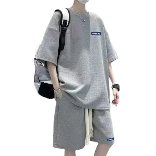 Waffle-textured cotton blend leisure sports suit set with short sleeve top and shorts.