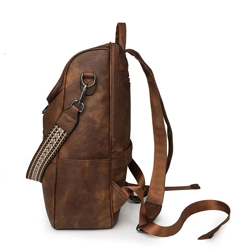 Retro college student backpack in PU leather with curved shoulder straps showing stitching detail