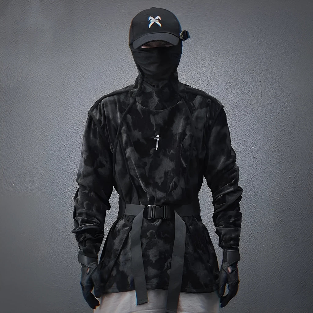 Black and grey tie dye printed men's turtleneck sweater with drop shoulders on a model.