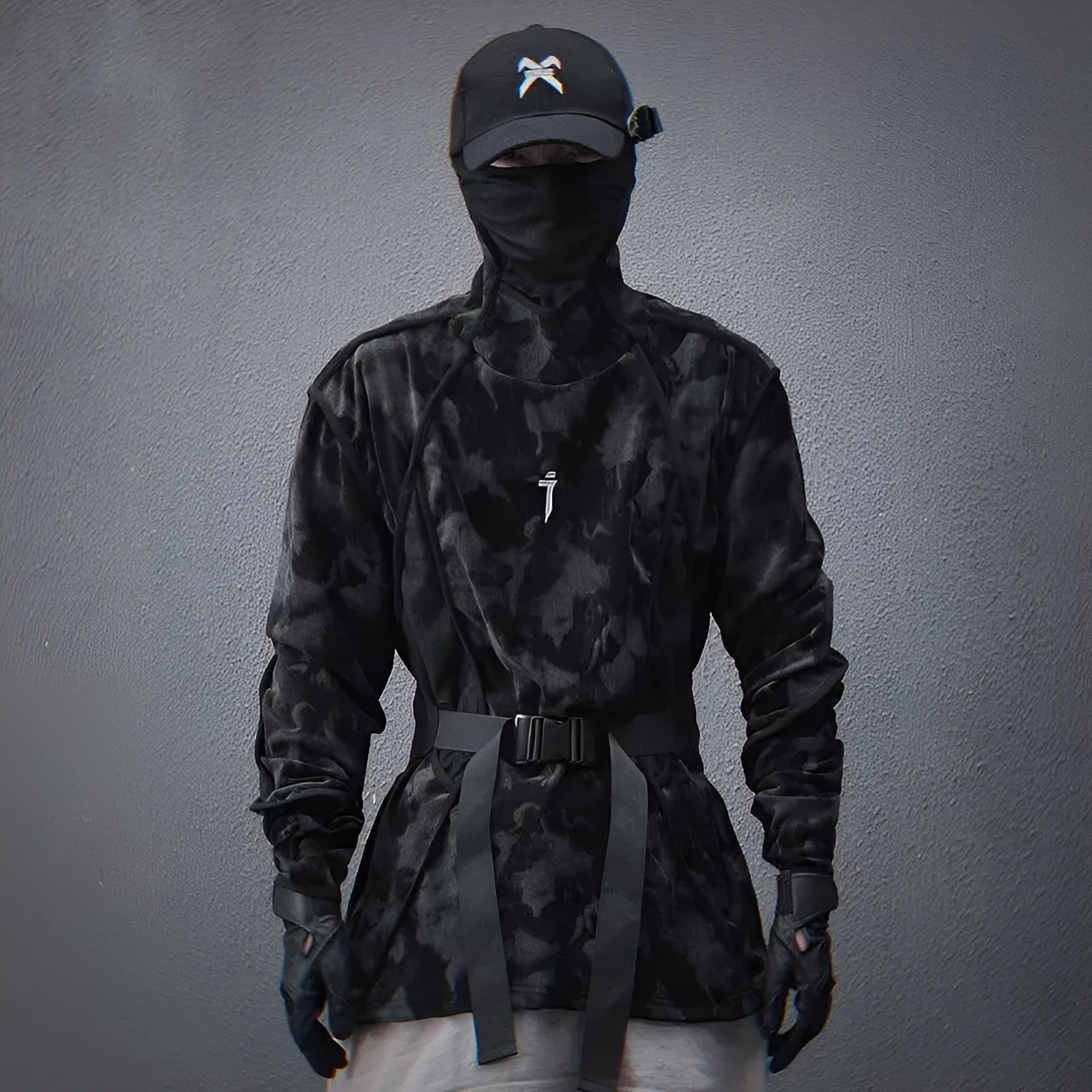 Black and grey tie dye printed men's turtleneck sweater with drop shoulders on a model.