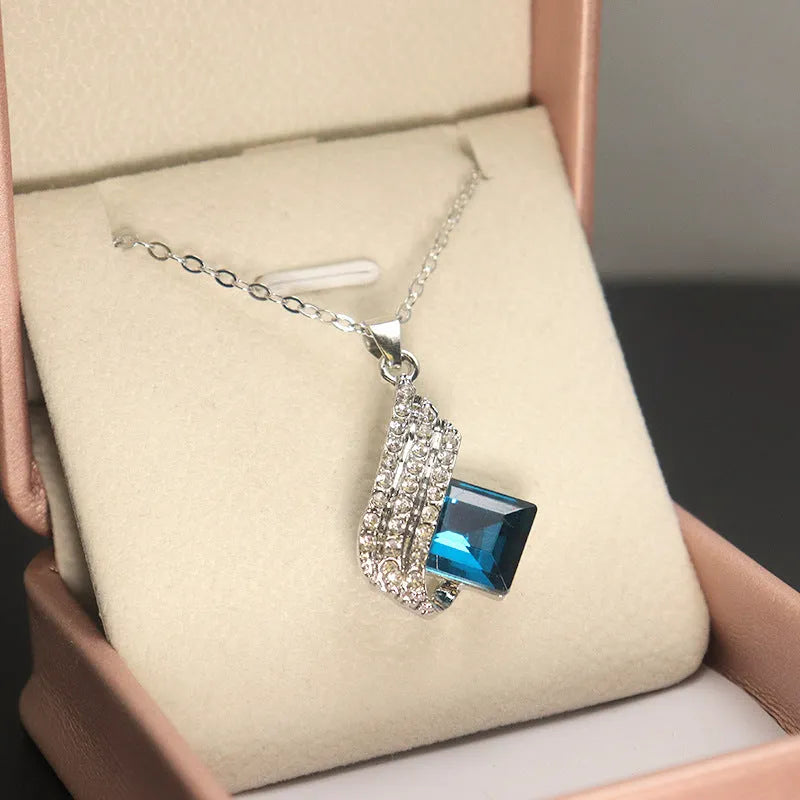 Women's alloy and glass cross chain necklace with matching electroplated ear studs set