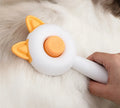 Self-cleaning pet grooming brush for cats with stainless steel teeth in greenish white colour