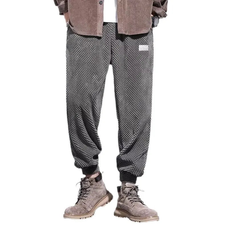 Men's grey ankle strap sweatpants with straight leg cut on mannequin