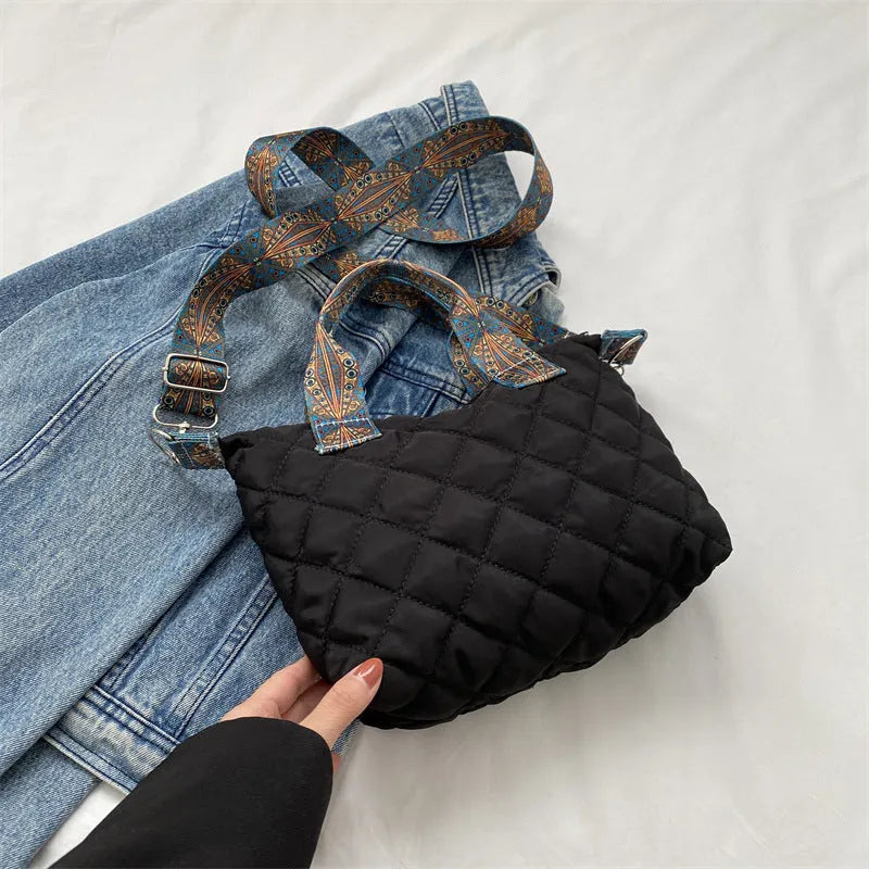 Soft horizontal square Oxford cloth shoulder messenger bag in green with embroidery detail and a single strap.