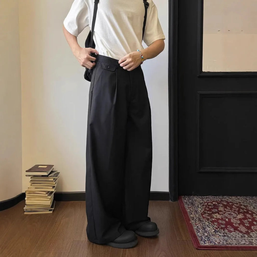 Men's straight-leg wide casual suit pants in brown solid colour, showing loose drape fit.