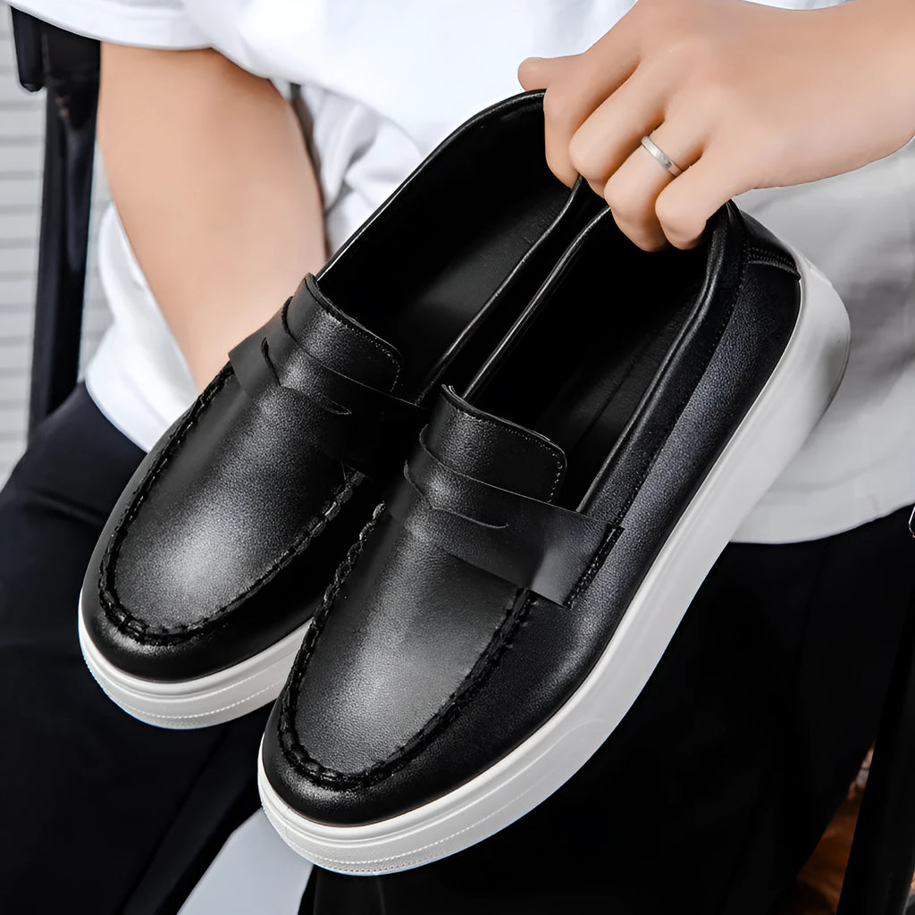Men's white PU leather slip-on loafers with round toe on a solid background.