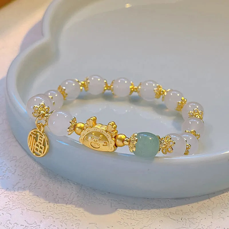 Women's floral glazed bracelet with zodiac animal charms and coloured glass beads